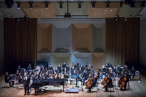Orchestra ready to perform on stage