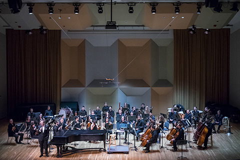 Orchestra ready to perform on stage